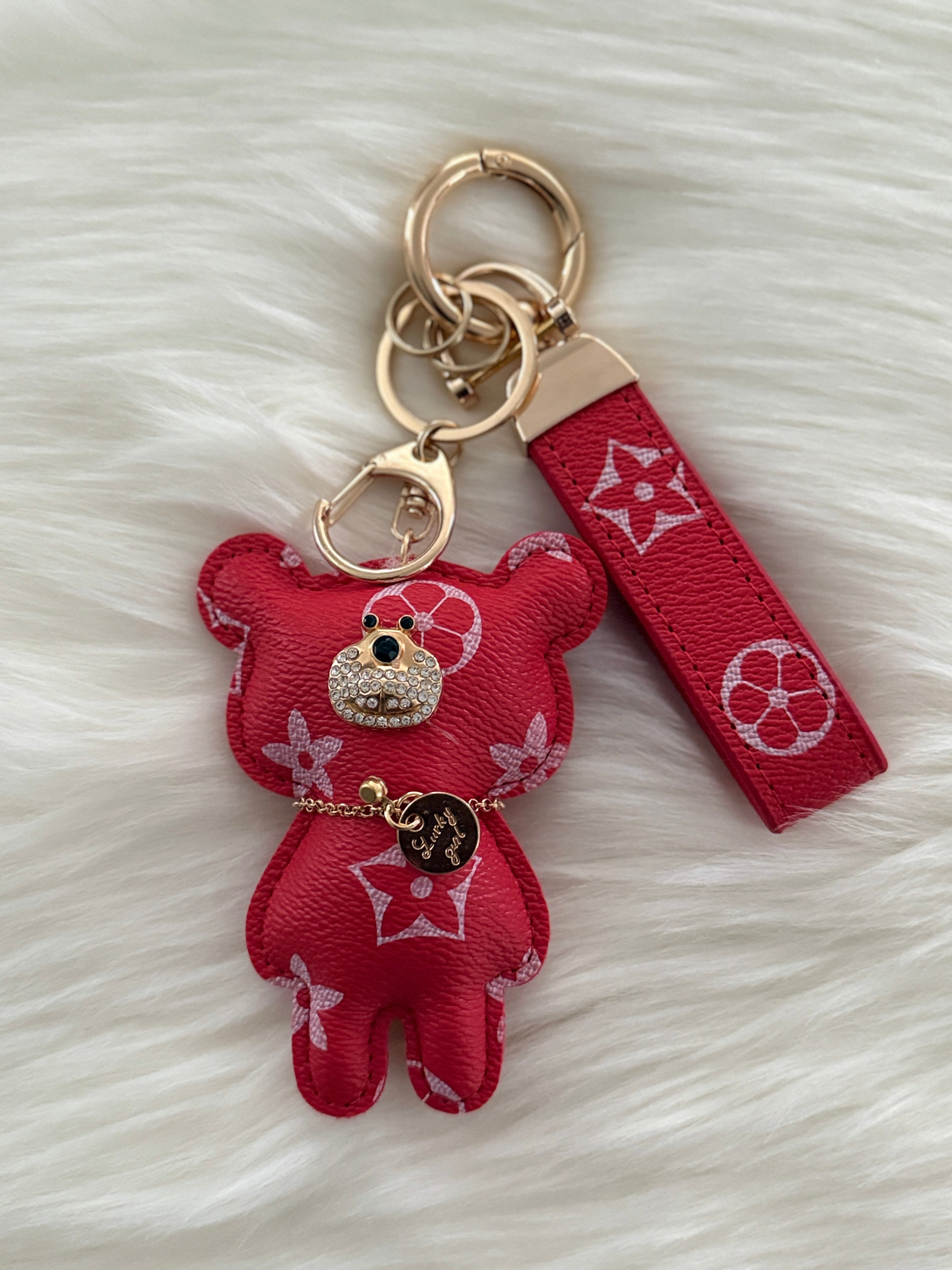 Red teddy charm keychain with matching strap and clasp.