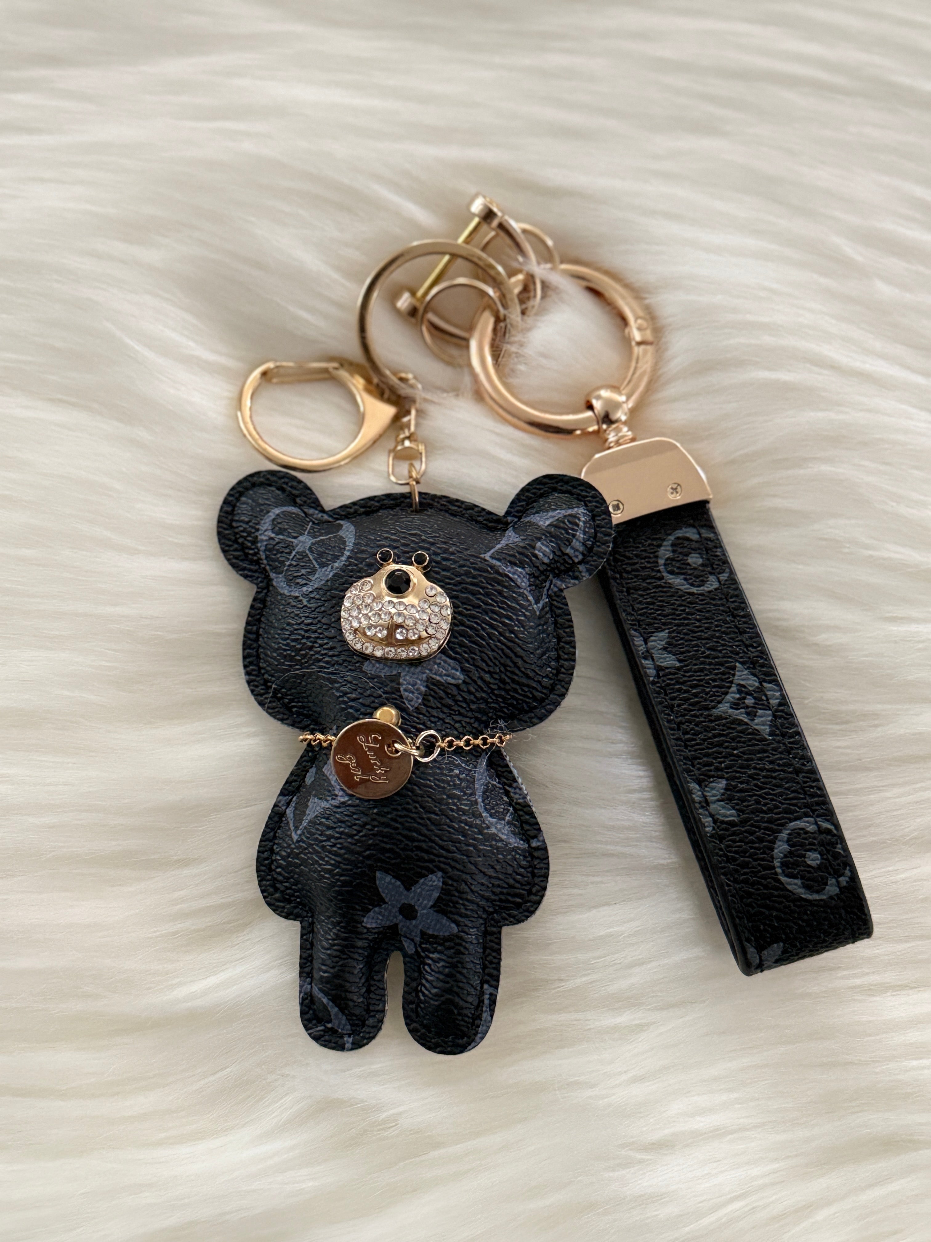 Light blue teddy charm keychain with matching strap and clasp.